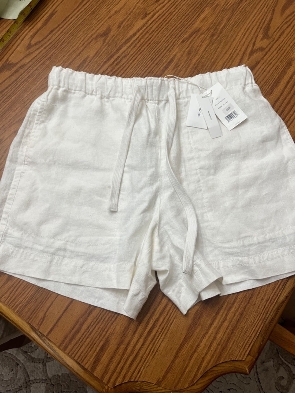 Woman’s Vince off white linen shorts.